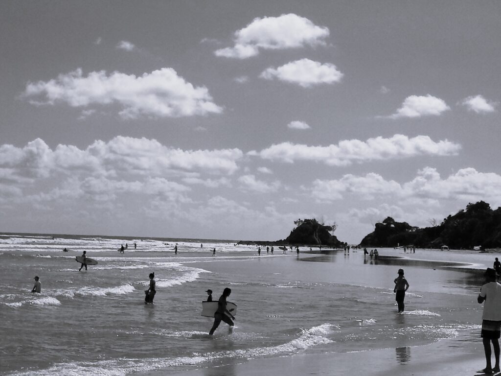 How to build a brand awareness program? Part 3 - banner image is black and white of people on the beach