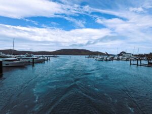 Sleeping with the Fishes, no cement shoes required: Image the entrance of Hamilton Island from the back view of a boat.