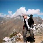 Kira-freelance-copywriter-Sydney on a mountain peak in the Himalayas.