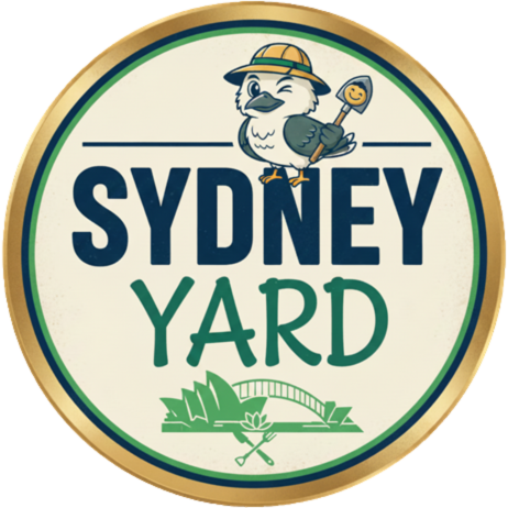 The Sydney Yard logo with a gold round border and Kookaburra dressed like a landscaper with bucket hat and shovel