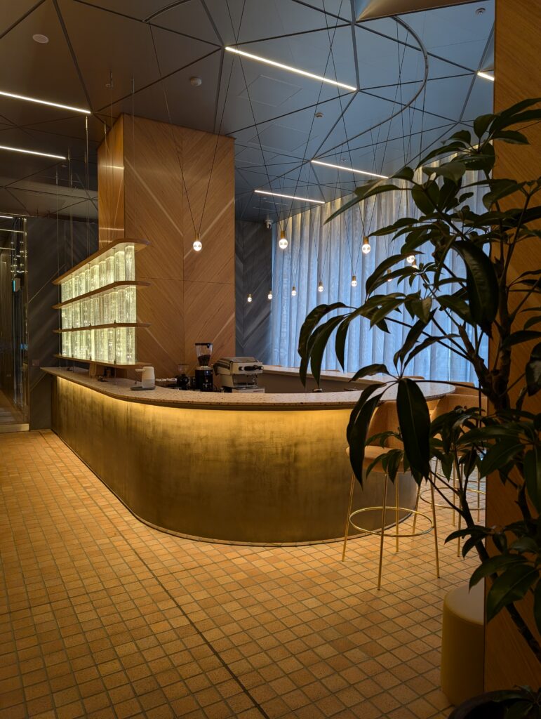 Local Secrets Edition 4: The Penthouse In The Sky. Image of the Bellustar ground floor lobby bar with warm tones.