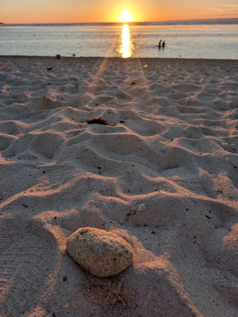 Local Secrets Review Edition 5 - Where Japan slows down. Image of the sunset over Sesoko Beach Okinawa.